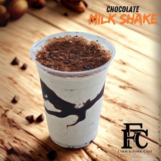 Photo of a chocolate milk share with cocoa on the top