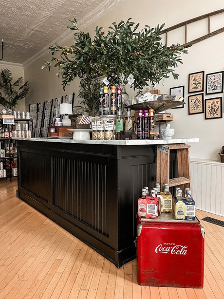 Photo of check out counter at mercantile on duke covered in local products