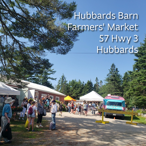 Photo of the outside of the Hubbards Barn Farmers' Market with people and tents