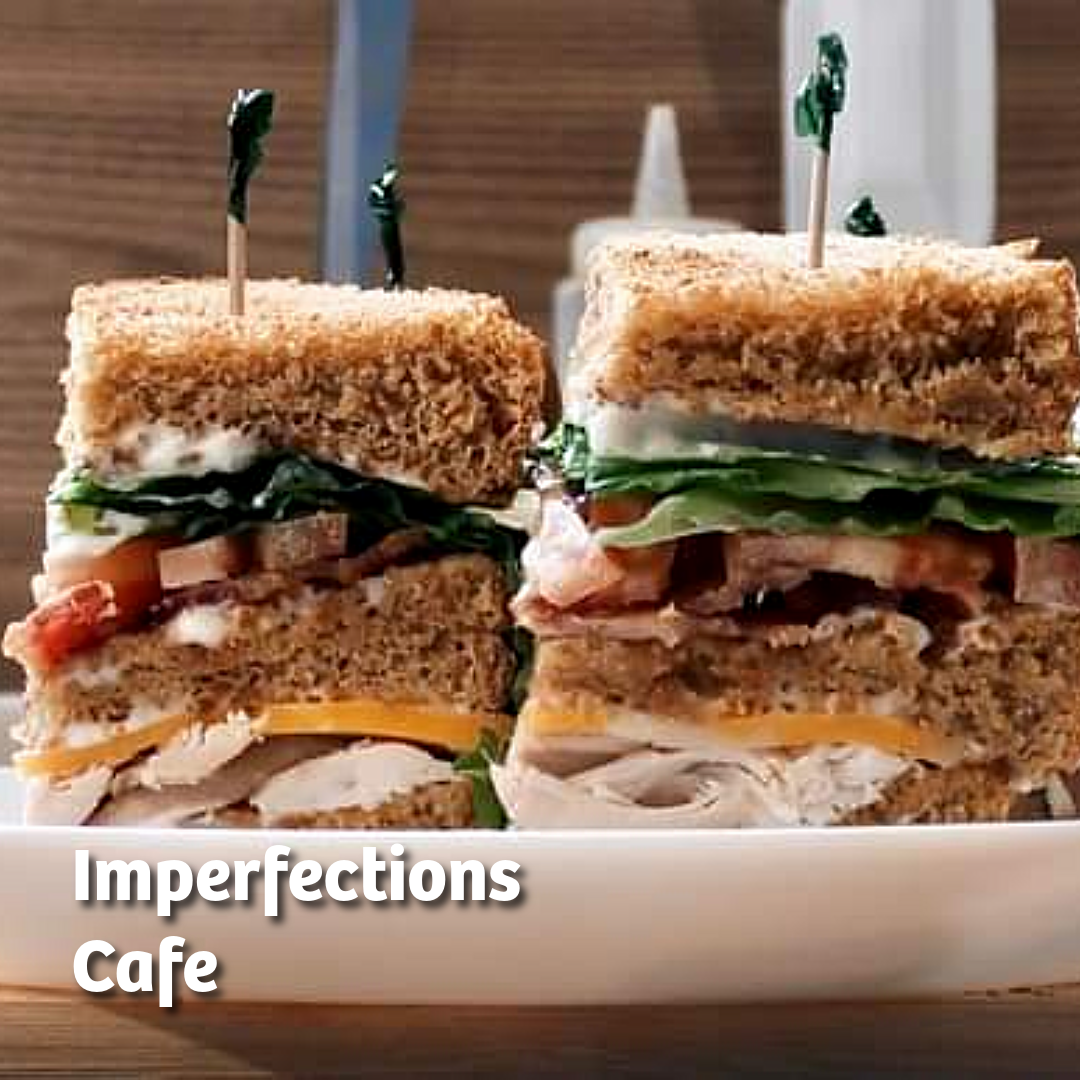 Photo of a club house sandwich on brown bread with bacon and roast turkey