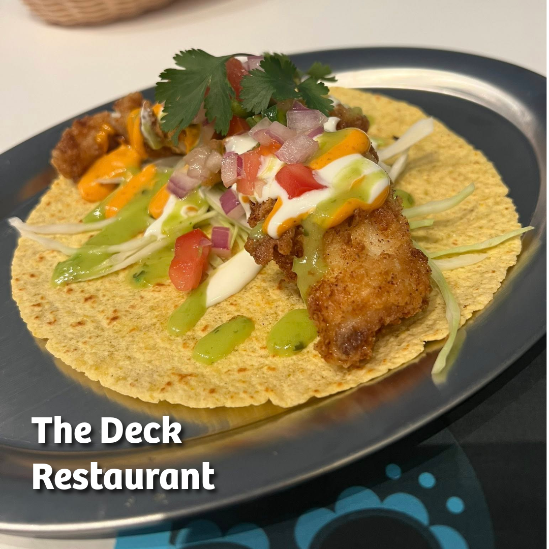 Photo of a fish taco with salsa and guacamole