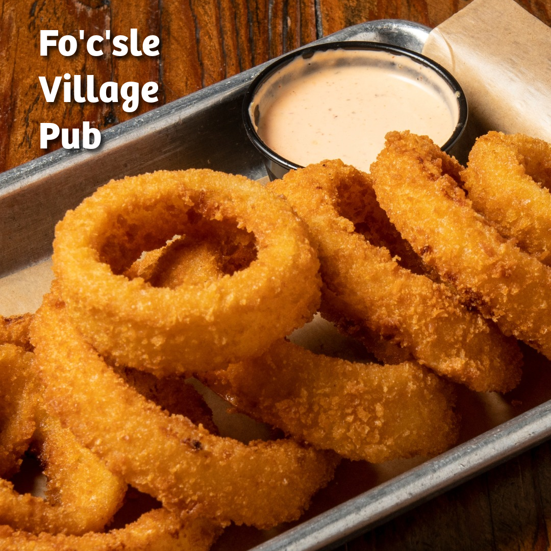 Photo of a tray of hand-breaded onion rings