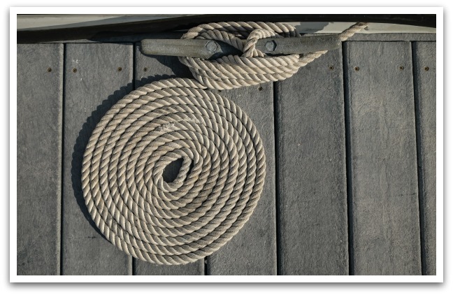 Rope tied to cleat on a dock