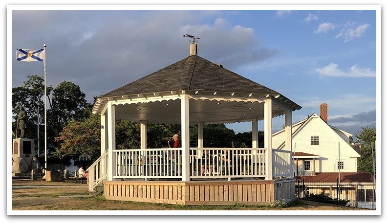 Bandstand with solo artist playing the saxophone.