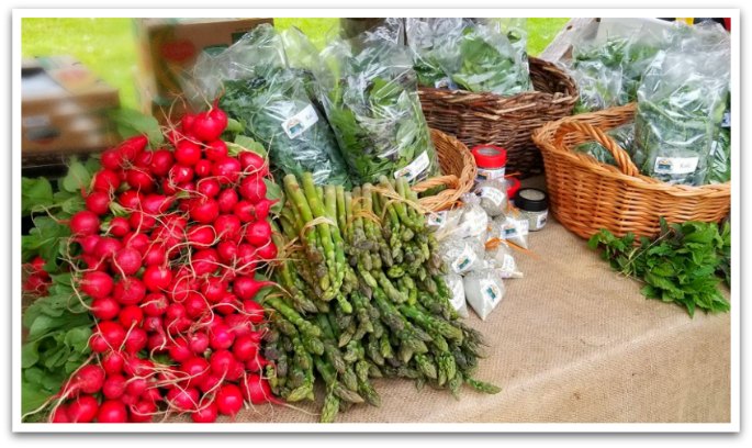 Fresh vegetables in whicker baskets on a table