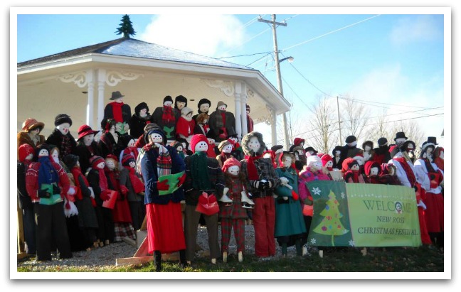 Neew Ross bandstand filled with mummers with a green sign reading "Welcome New Ross Christmas Festival".