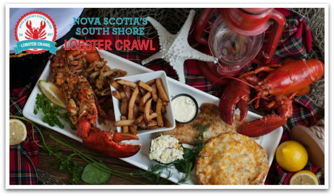 Lobster meal with fries on a table with decorative lobster, star fish, and oil lamp by it. Lobster Crawl logo on top with the caption "Nova Scotia's South Shore Lobster Crawl".