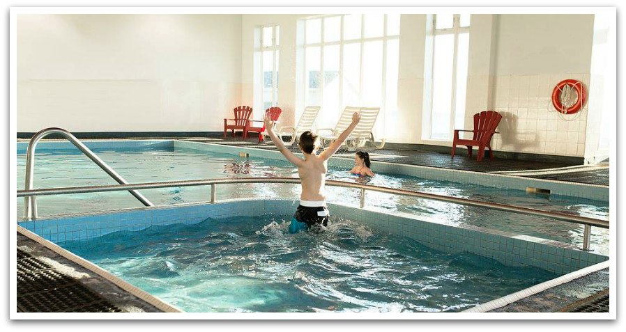 Kids playing in an indoor pool