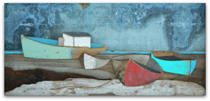 Weathered painting of red and green fishing boats on rocks.
