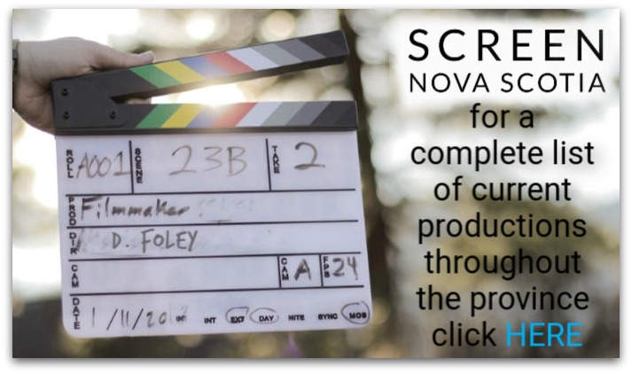 Photo of a clapperboard with the text "Screen Nova Scotia for a complete list of current productions throughout the province click here."