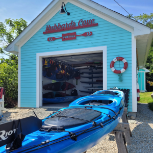Photo of Hubbards Cove Rentals Location, blue building with kayak in the front