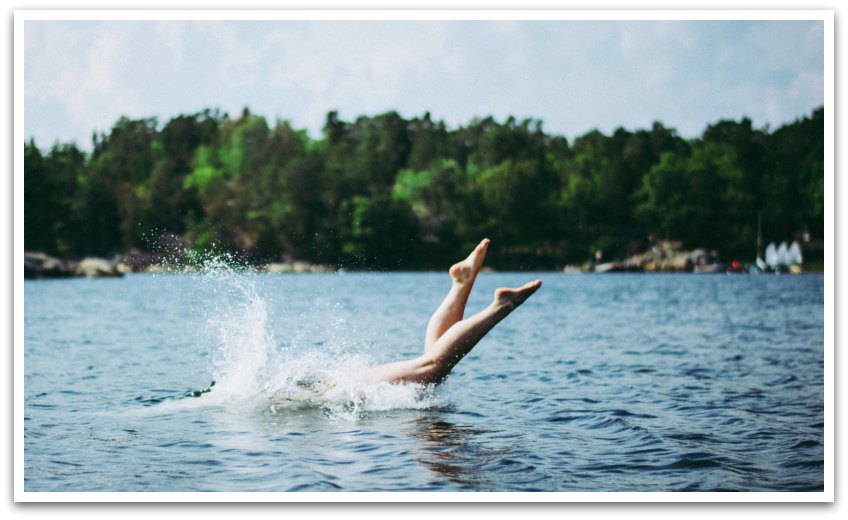 Person diving into a lake