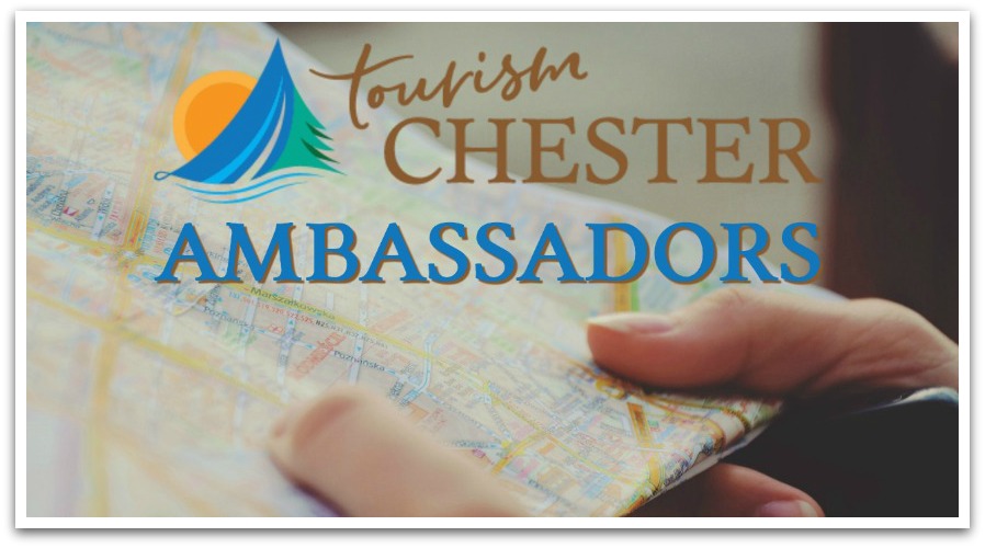 Person holding a map with text overlaid reading "Tourism Chester Ambassadors".