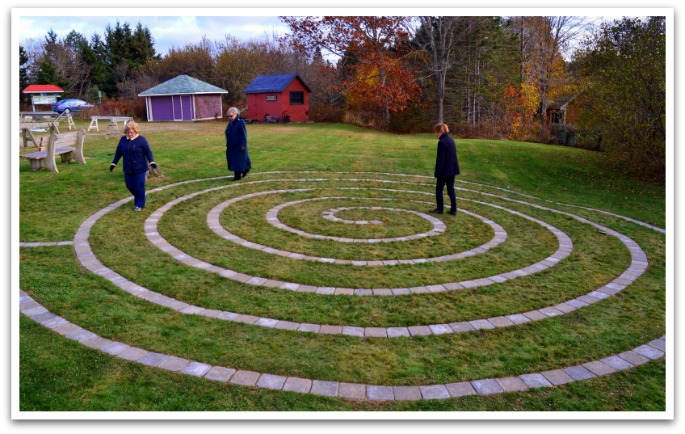 Three women walking around the Labyrinth